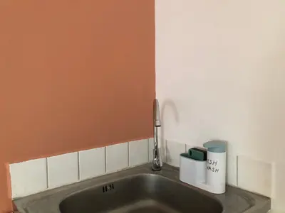 a sink with a faucet in a bathroom at Popular CondoT8@IMPACT Arena in Nonthaburi