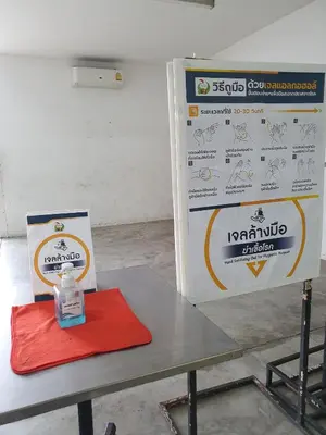 a table with a bottle on it next to a box at Popular CondoT8@IMPACT Arena in Nonthaburi