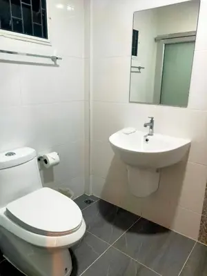 a bathroom with a toilet and a sink at Bed By Boat @Nonthaburi Pier in Nonthaburi