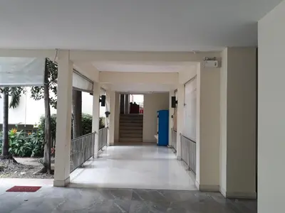 a hallway of a building with a blue door at D-haus Ladprao Residence in Bangkok
