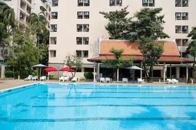 a large swimming pool in front of a building at D-haus Ladprao Residence in Bangkok