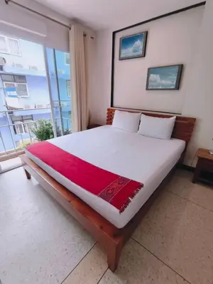 a bedroom with a large bed with a large window at Cloud no 3 Serene Oasis King Bed in BKK Heart in Bangkok