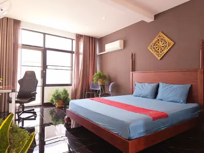 a bedroom with a bed and a desk and a chair at Old Spice 4 Downtown Serenity Luxurious Oasis BKK in Bangkok