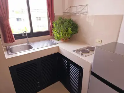 a small kitchen with a sink and a window at Old Spice 4 Downtown Serenity Luxurious Oasis BKK in Bangkok
