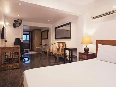 a bedroom with a bed and a living room at Old Sрice 2 Urban Studio Oasis Central Bangkok MRT in Bangkok