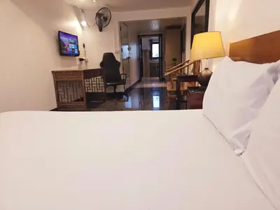 a bedroom with a bed and a living room at Old Sрice 2 Urban Studio Oasis Central Bangkok MRT in Bangkok
