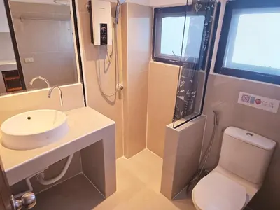 a bathroom with a shower and a toilet and a sink at Old Sрice 2 Urban Studio Oasis Central Bangkok MRT in Bangkok