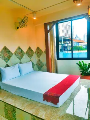 a bed in a room with a large window at Sky bedroom with a smooth life view in Bangkok