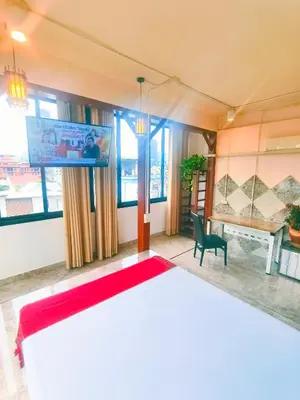 a bedroom with a large bed and a television at Sky bedroom with a smooth life view in Bangkok