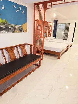 a bedroom with two beds and a staircase at Old Sрice 1 Sizzling Studio Queen Twin - No Stairs in Bangkok