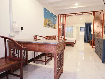 a room with a desk and chairs and a couch at Old Sрice 1 Sizzling Studio Queen Twin - No Stairs in Bangkok