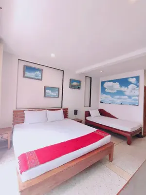 a bedroom with two beds and two windows at Cloud no 4 Green n Quiet Heart BKK With a Balcony in Bangkok