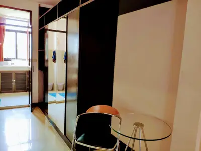 a dining room with a glass table and a chair at Old Sрice 5 Elegant Tranquility Your BKK Haven in Bangkok