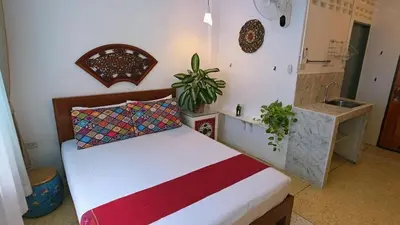 a bedroom with a bed and a sink at Lumphini 5 Train station center EnSuite Aircon in Bangkok
