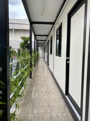 a corridor of a building with potted plants at P29 in Bangkok