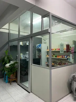 a fast food restaurant with glass doors and a counter at P29 in Bangkok