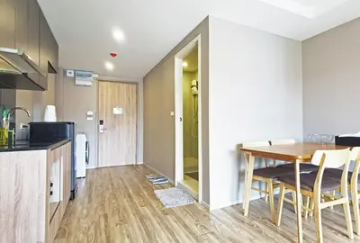 a kitchen and dining room with a table and chairs at Blossom Sathorn Hospitality \uff08\u66fc\u8c37\u9ad8\u7aef\u9152\u5e97\u516c\u5bd3\uff09 in Bangkok