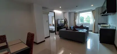 a living room with a couch and a table at City Plaza Nana Hotel in Bangkok