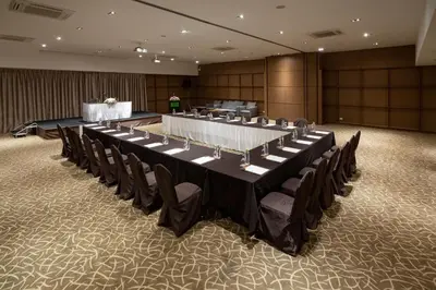 a large conference room with a long table and chairs at S Ratchada Leisure Hotel in Bangkok