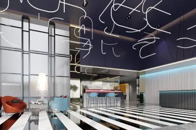 a lobby of a hotel with a room with a lobby at The Quarter Silom by UHG in Bangkok
