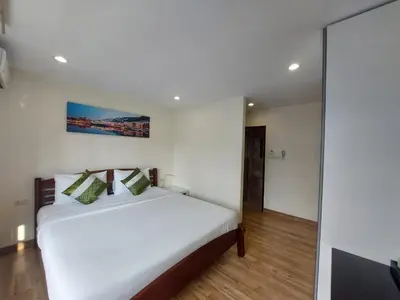 a bedroom with a white bed in a room at V Check inn Sukhumvit 22 in Bangkok