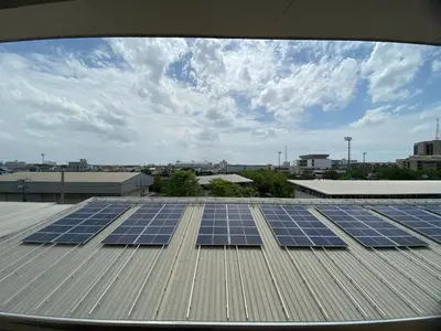 a group of solar panels on top of a roof at Ladapan Mansion in Nonthaburi