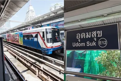 a train on the tracks at a train station at Gfeel Hostel in Bangkok