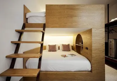 a room with two bunk beds and a bed at B House 49 Bangkok in Bangkok