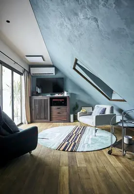 a living room with a couch and a table at B House 49 Bangkok in Bangkok