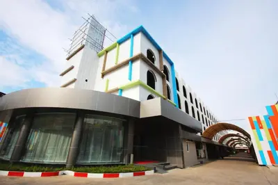 a large building with a geometric design on it at Royal Delight Hotel in Bangkok