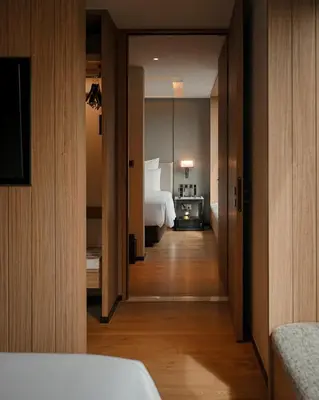 a hotel room with a bed and a bedroom at Homm Sukhumvit34 Bangkok in Bangkok