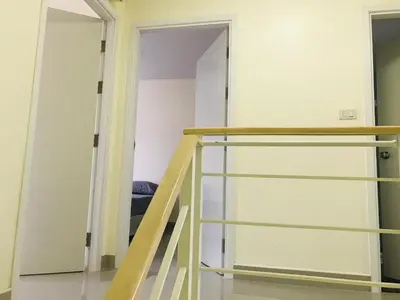 a ladder leading into a room with a closet at Impact MT House in Ban Bang Phang