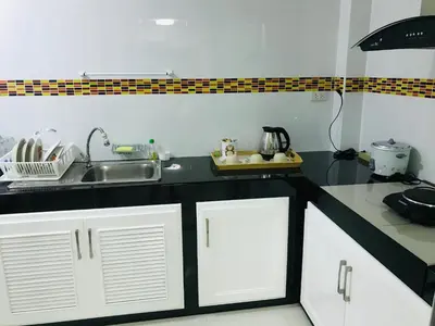 a kitchen with a sink and a counter top at Impact MT House in Ban Bang Phang