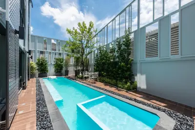 an image of a swimming pool on the side of a building at Kaya Heritage Hotel in Bangkok