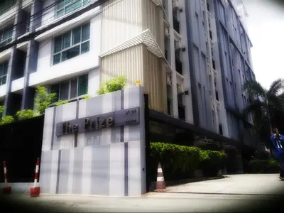 a man is standing in front of a building at THE PRIZE in Ban Yang