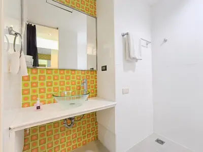 a bathroom with a sink and a mirror at Citin Sukhumvit 11 Nana Bangkok by Compass Hospitality in Bangkok