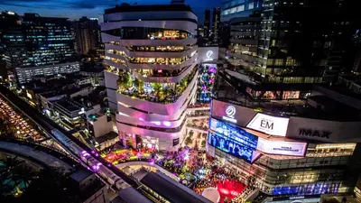 a view of a city at night with lights at Arawana Residence Phromphong in Bangkok