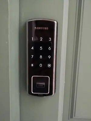 a remote control is attached to a door at Baan Khun Pra Duplex Rm3 Bangkok in Bangkok