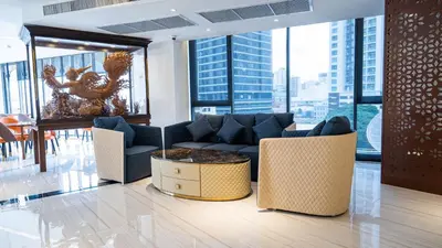 a living room with a couch and a table at Pannarai Hotel Bangkok-Pra tunam in Bangkok