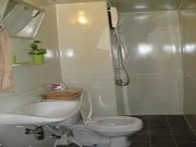 a bathroom with a toilet and a sink and a shower at Near Impact Challenger Bangkok Thailand in Nonthaburi