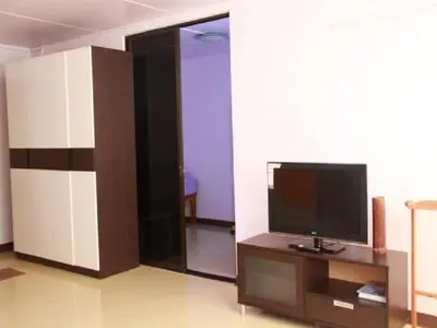 a living room with a flat screen tv on a table at Near Impact Challenger Bangkok Thailand in Nonthaburi