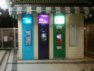 two atm machines on the side of a building at Near Impact Challenger Bangkok Thailand in Nonthaburi