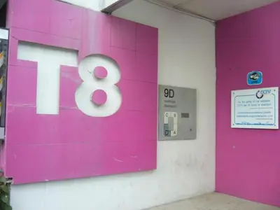 a pink sign with the number eight on a wall at Asia Don Mueang Bangkok Condominium in Thung Si Kan