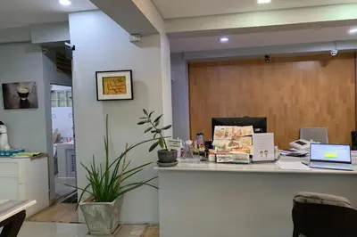 an office with a desk with a laptop on a counter at 41BKK Hotel Rama9 in Bangkok