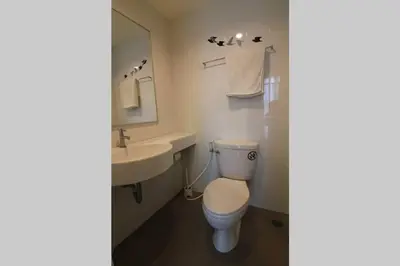 a bathroom with a toilet and a sink at Nice Condo near Ramkhamhaeng 60, Lam Sali MRT in Bangkok