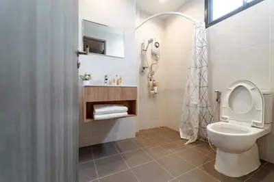a bathroom with a toilet and a sink at My space69 in Ban Pak Khlong Khwang