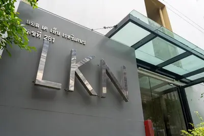 a sign on the side of a building at LKN RESIDENCE in Pom Prap