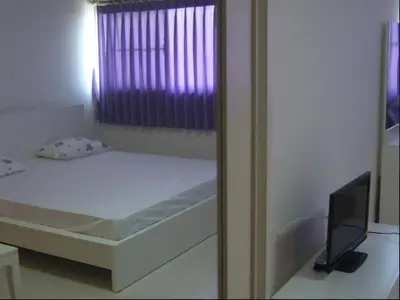 a small bed in a room with a window at Impact -Challenger Muang thong Thani in Thung Si Kan