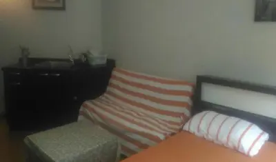 a bedroom with a bed and a dresser and a bench at Family Room Dmk Don mueang Airport 2 bedrooms in Ban Bang Phang