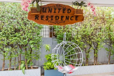 a sign that reads limited resilience next to a bird cage at United Residence Ekamai Bangkok in Bangkok